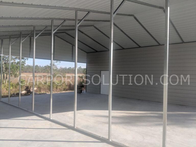 Interior view of custom metal barn with steel framing by Carport Solution