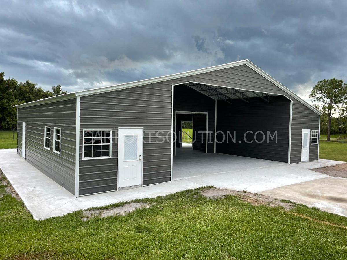 Custom enclosed metal barn with open front built in Florida by Carport Solution